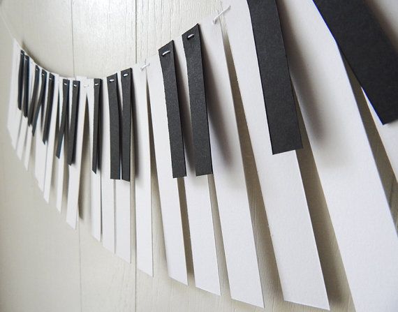 black and white paper streamers are hanging on the wall