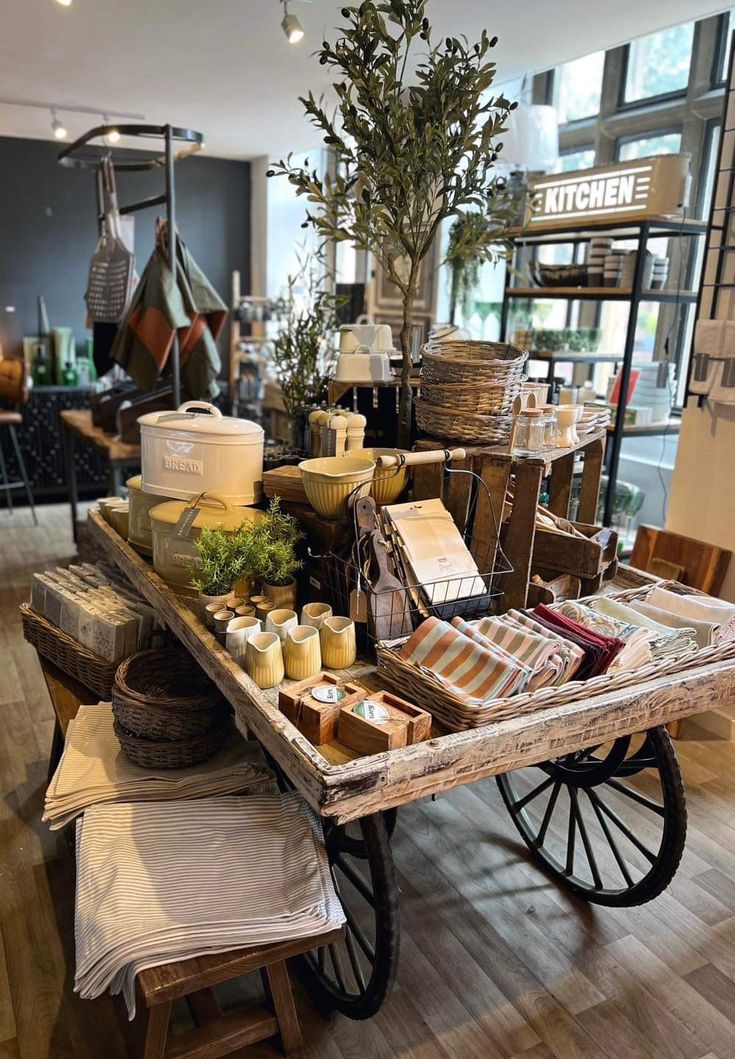 an old wooden cart filled with lots of items