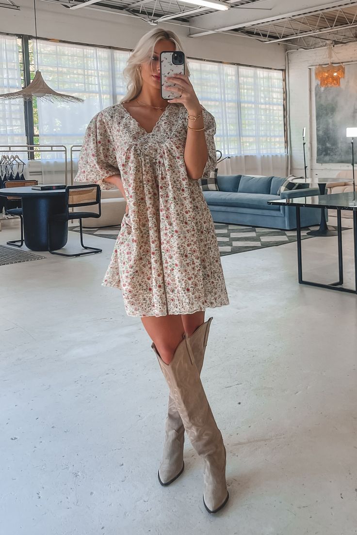 And there’s no better dress to be wearing for that moment!! Look how adorable this is!! Cream and rose multi color floral flowy mini dress, short puff sleeve, lace details along the v neckline, dress is lined Material is Cotton Hang to dry Model is 5’7 wearing a small SHOP THE LOOK Casual Country Wedding Outfit Guest, Bohemian Lace Mini Dress With Short Sleeves, Country Wedding Outfit Guest, Bohemian Flowy Lace Mini Dress, Spring Mini Dress With Lace Sleeves And V-neck, Flowy Floral Print Boho Mini Dress, Country Wedding Outfit, Casual Country Wedding, Wedding Guest Romper