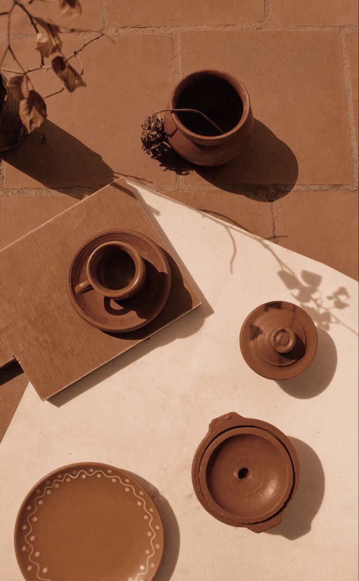 some cups and saucers sitting on a table