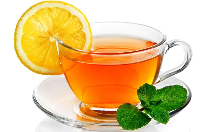 a cup of tea with lemon and mint