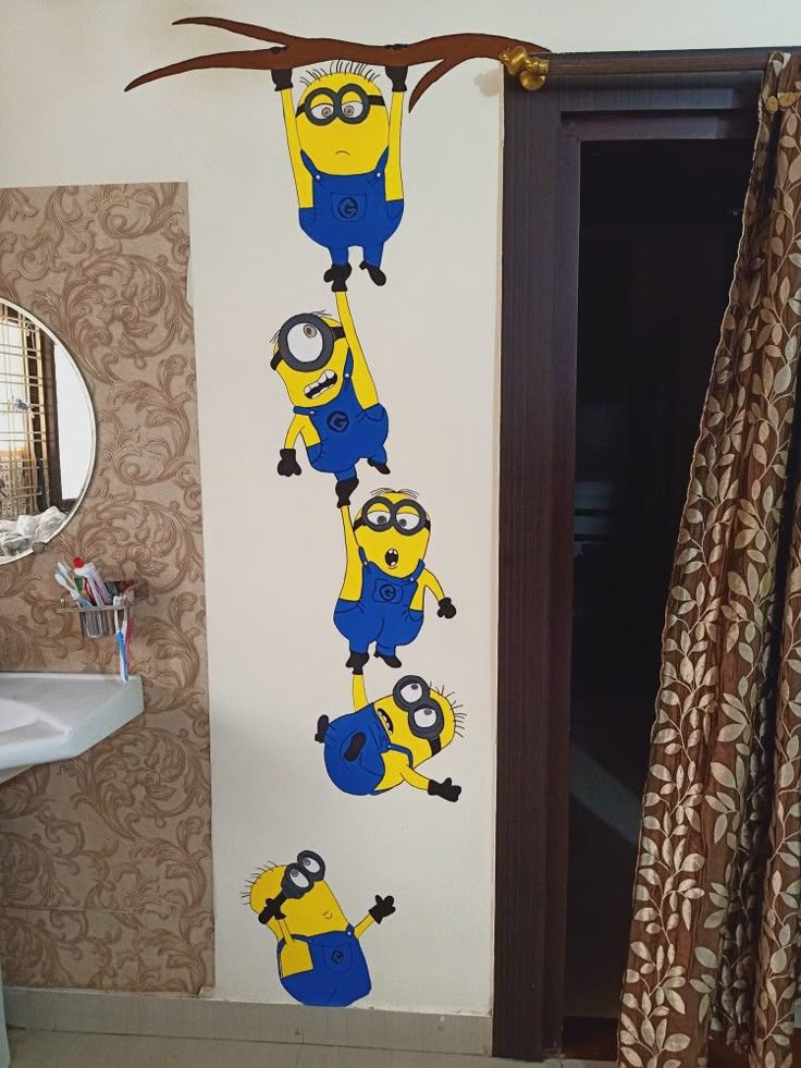 a bathroom decorated in the theme of minions from despicables with blue and yellow decorations