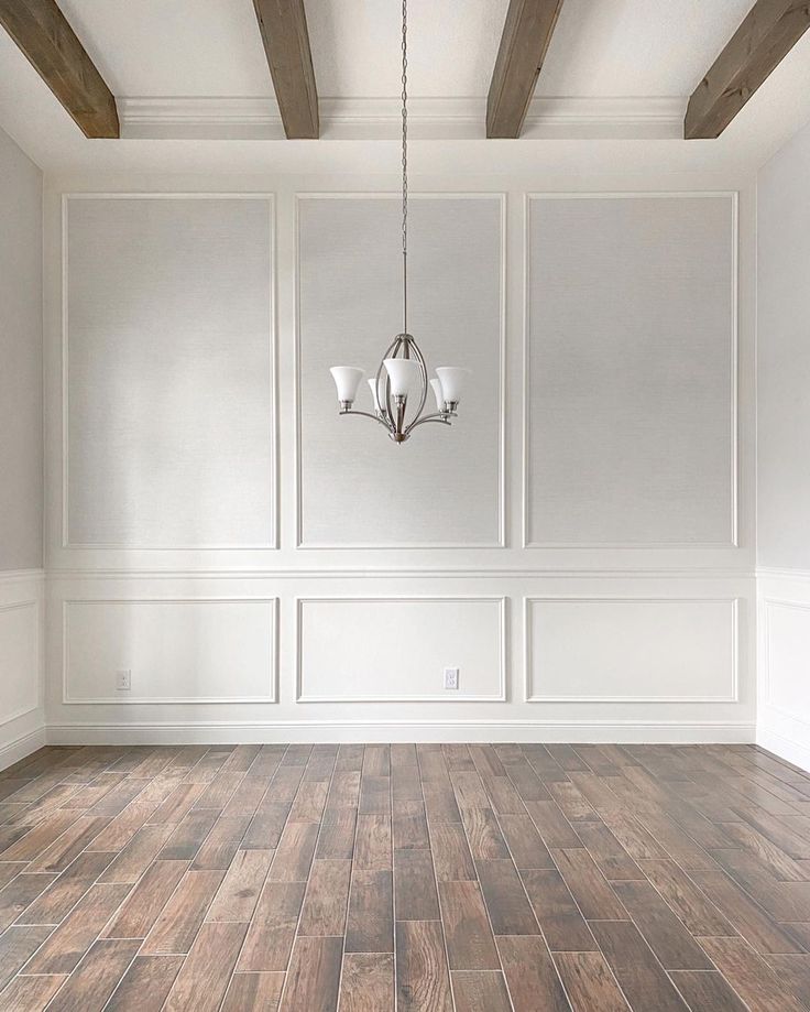 an empty room with white walls and wood flooring is featured on instagrams