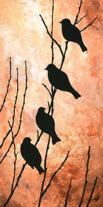 three birds perched on branches in front of an orange sky