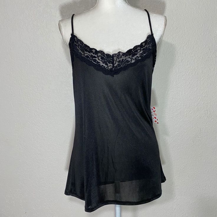 Free Kisses Black Camisole Tank Blouse Size: Large Color: Black Approximate Measurements Pit To Pit: 20in Length: 24in New With Tag Flirty Camisole With Built-in Bra For Night Out, Flirty Sleeveless Sheer Top, Black Flirty Tank Top For Summer, Flirty Black Tank Top For Summer, Flirty Black Summer Tank Top, Black Tank Top With Built-in Bra For Loungewear, Casual Black Camisole For Loungewear, Black Cami Top With Built-in Bra, Sheer Stretch Camisole Top