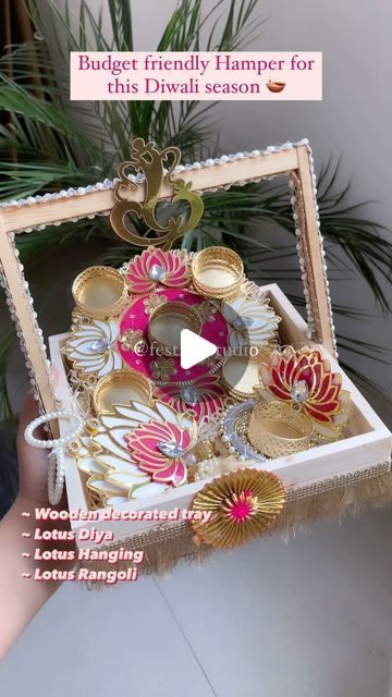 a person holding a box filled with lots of different types of jewelry in it's hands