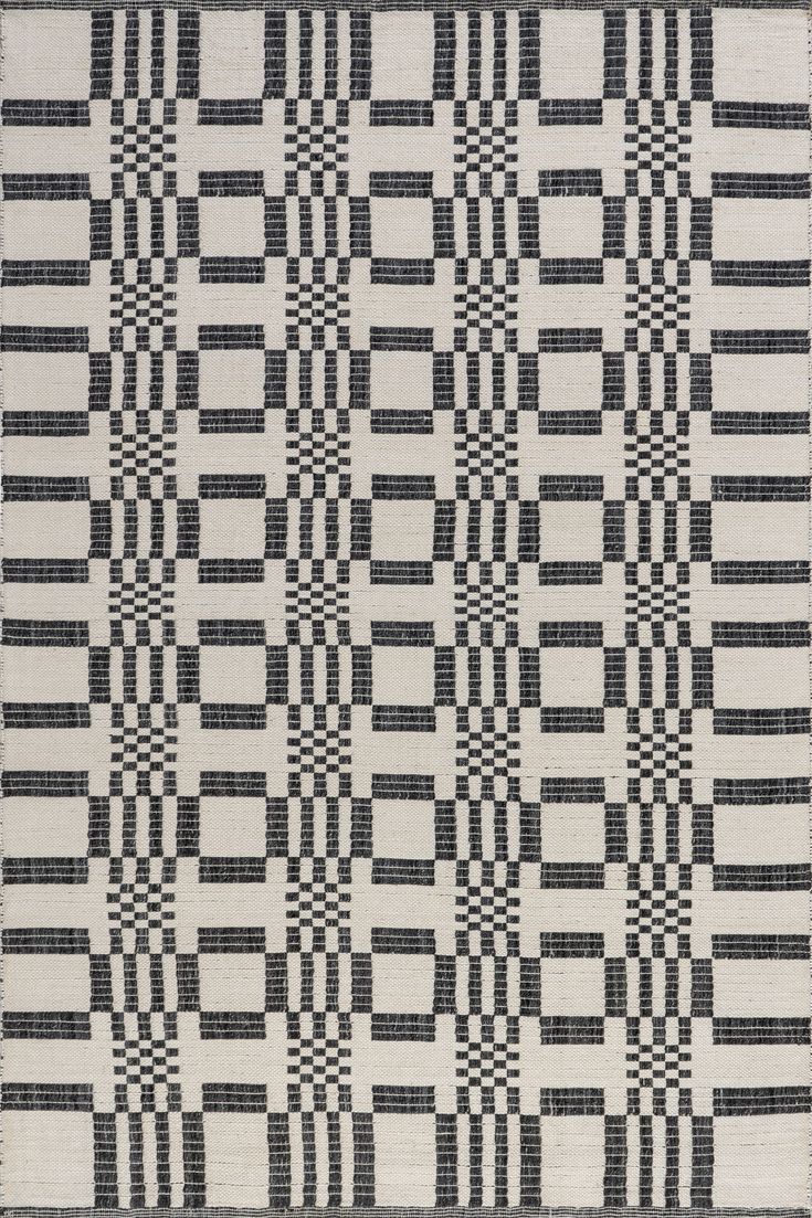 a black and white rug with squares on it