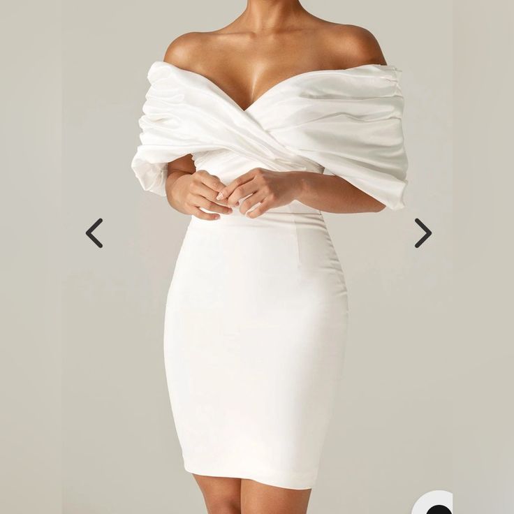 Made From A Luxurious Soft Heavyweight Crepe That Really Sculpts And Shapes Your Figure To Cinch Your Waist And Create The Perfect Figure Hugging Silhouette. The Oversized Satin Ruffles To The Shoulders Add Drama Yet It Sits Perfectly In An Off Shoulder Cut. The Boning Detailing Extends Down To The Waist In A Pretty Shape And Through The Back And Sides To Really Exaggerate The Curves And Underwired Cups Design Means You Don't Need A Bra. - Lining: Fully Lined - Made From: Crepe And Satin Fabrics - Stretch Factor: 1/3 - Dress Length: Approx. 36" In - Material: Crepe (95% Polyester, 5% Elastane), Satin (97% Polyester, 3% Elastane) - Care: Gentle Dry Clean Only Elegant White Draped Midi Dress, Elegant White Draped Dress, White Draped Midi Dress For Formal Occasions, White Draped Evening Dress, Elegant Off-shoulder Mini Dress For Brunch, White Ruched Mini Dress For Evening, White Fitted Dinner Dress, White Ruffled Dressy Mini Dress, White Dressy Mini Dress With Ruffles