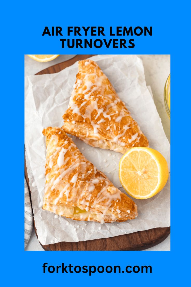 two lemon turnovers sitting on top of a cutting board