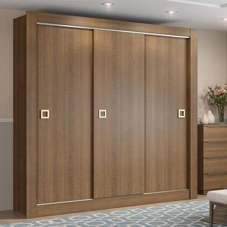 a large wooden closet with two doors and drawers