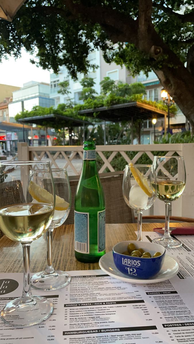 three glasses of wine are sitting on a table