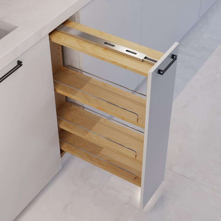 an open cabinet in the middle of a white counter top with drawers on both sides