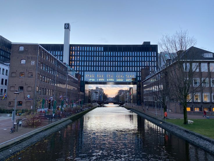 a river running through a city next to tall buildings