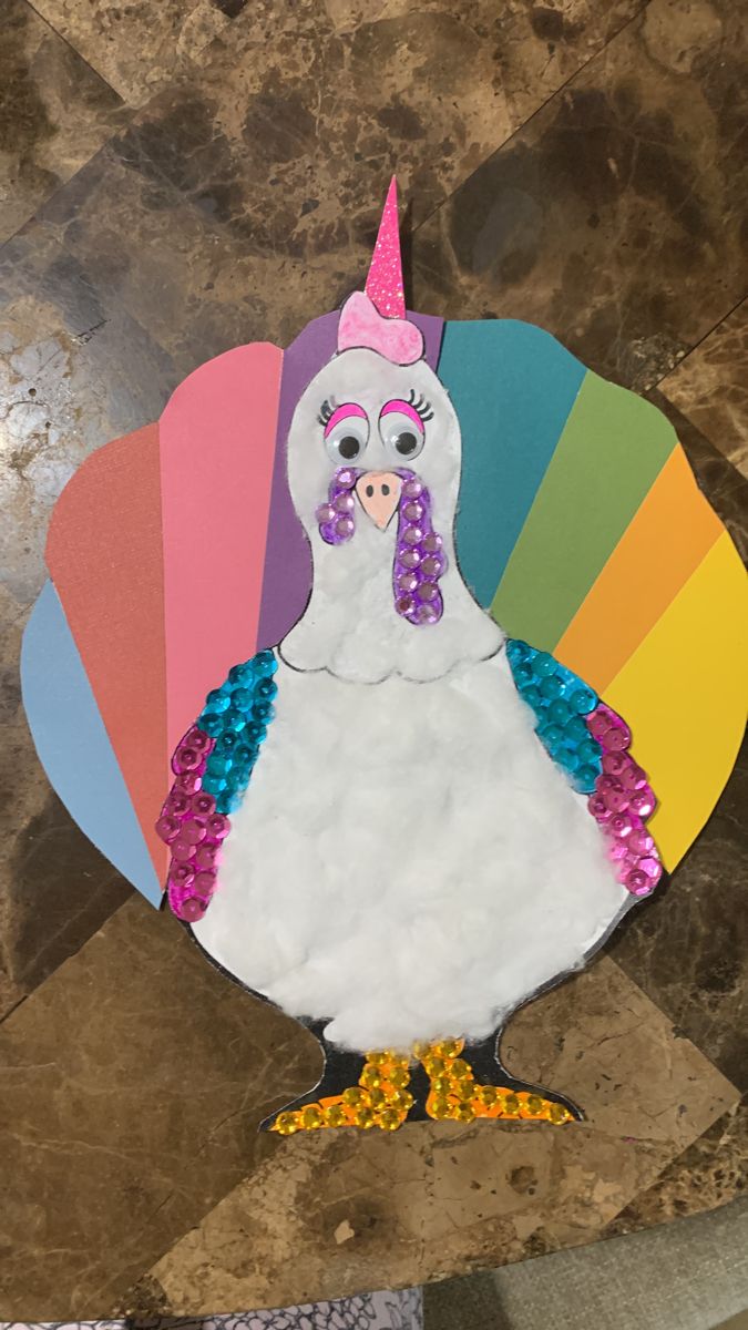 a paper turkey with a unicorn horn on it's head