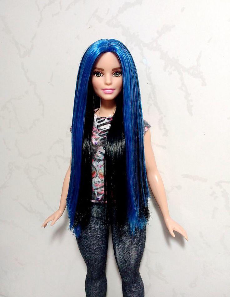 a doll with blue hair and black pants