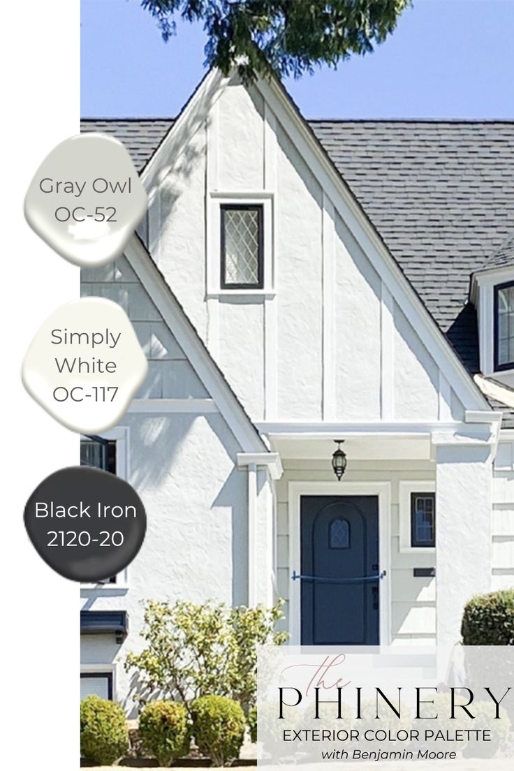 a white house with black iron exterior paint colors