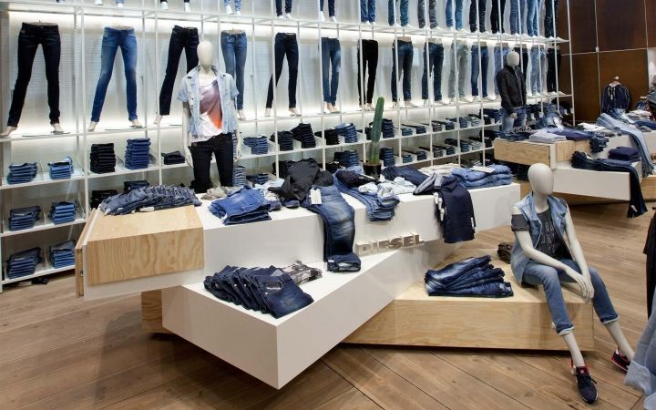 there are many different types of clothes on display in the store, including jeans and jackets