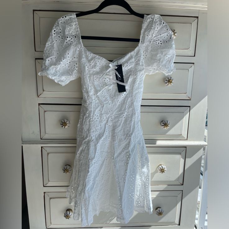 White Eyelet Dress With Bow Detail In The Front Lulus Dress, Dresses Lulus, Bow Tie Dress, White Eyelet Dress, Lulus Dresses, Dress With Sleeves, Bow Dress, Eyelet Dress, White Eyelet