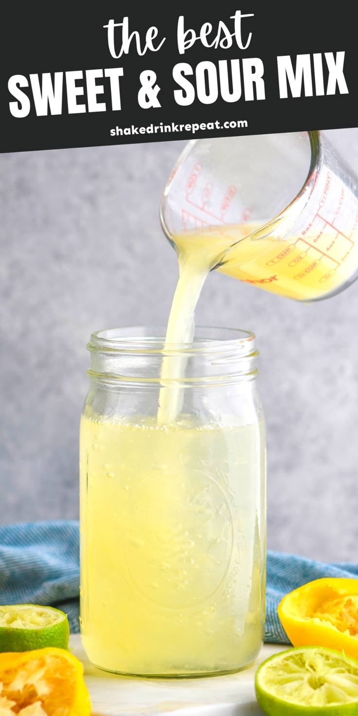 the best sweet and sour mix is being poured into a mason jar with sliced oranges