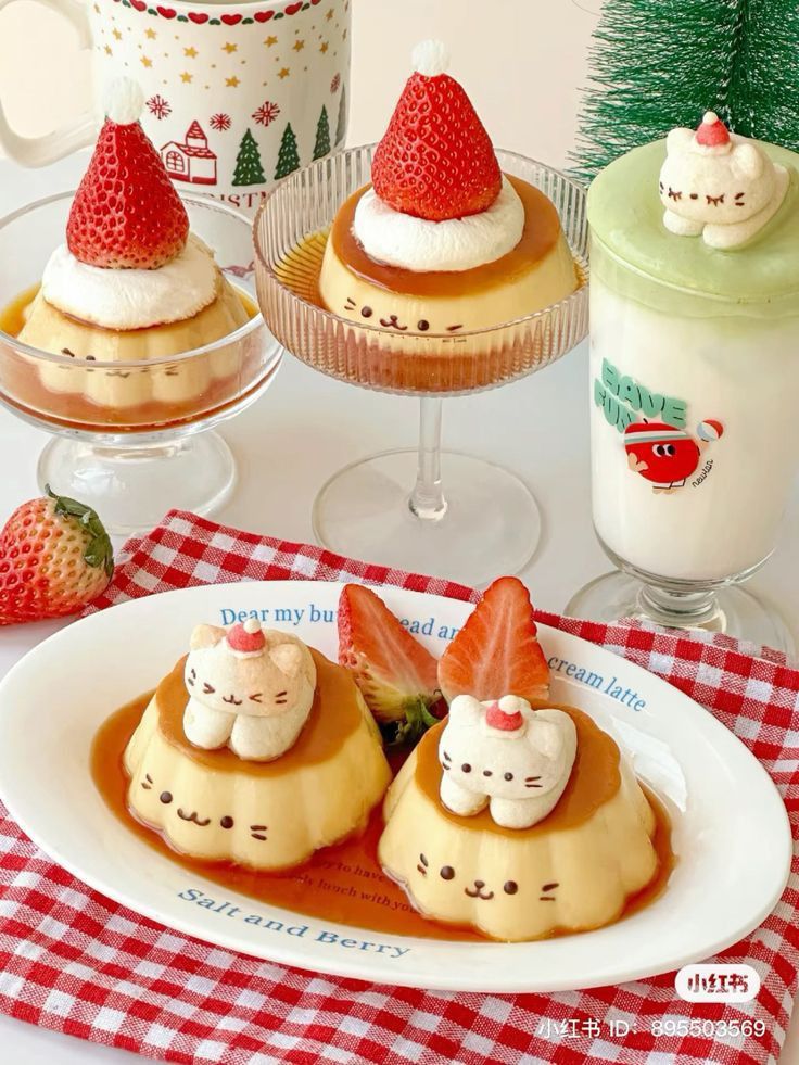 some desserts are sitting on a table with strawberries and milk in the background