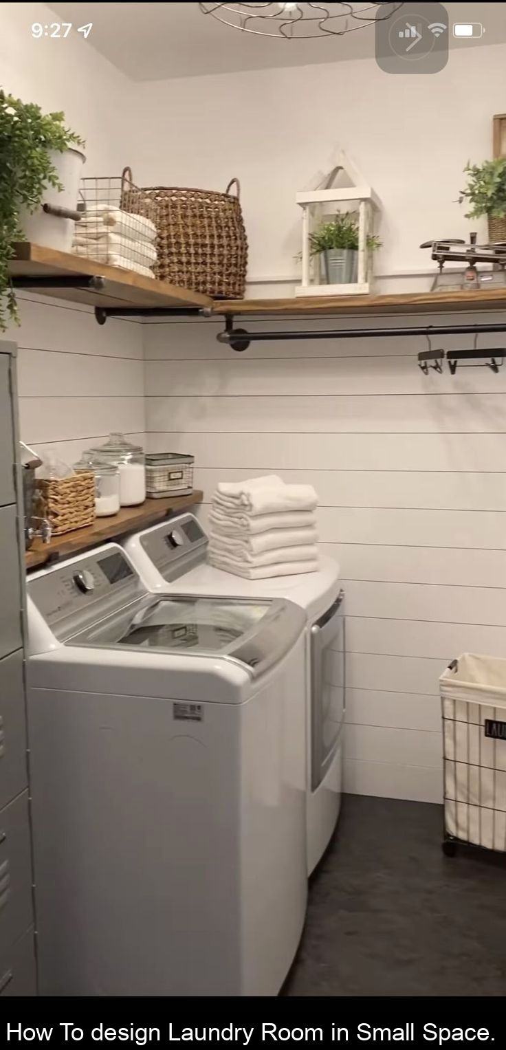 a washer and dryer in a room with shelving on the wall behind them