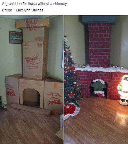 there is a cardboard box on the floor next to a christmas tree and a fireplace