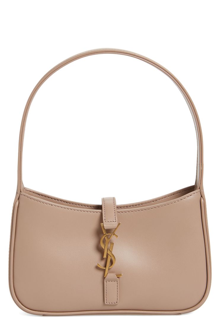 Done in vegetable-tanned leather and branded with a YSL insignia, this scaled-down hobo is perfect for all your desk-to-dinner—and beyond—social activities. Hook tab closure Top carry handle Suede lining Leather Made in Italy Designer Handbags Ysl Nude Bag, Designer Tan Bag, Beige Ysl Bag, Ysl Hobo, Purse Outfit, Micro Bag, Fall Bags, Ysl Bags, Taylor Made