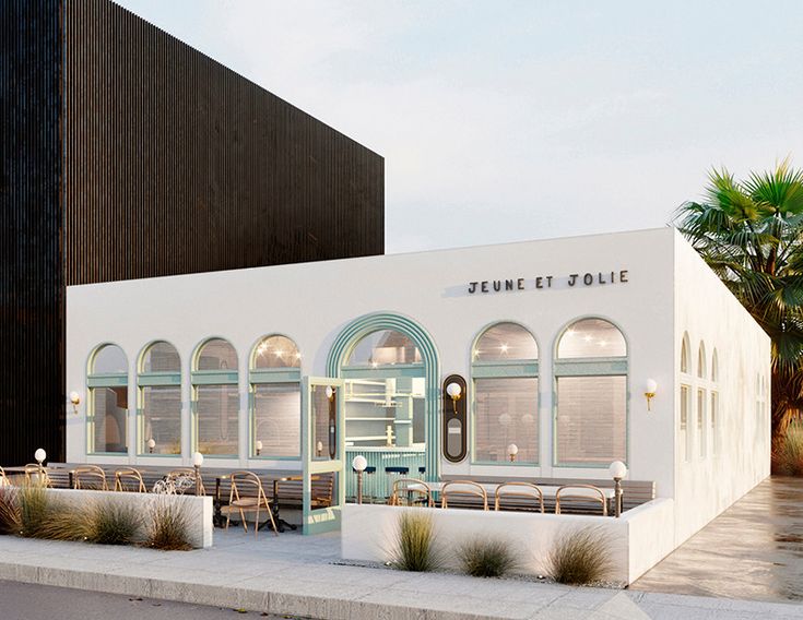 an artist's rendering of the exterior of a building with tables and chairs outside