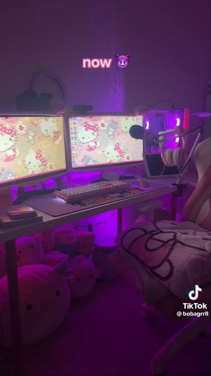 two computer monitors sitting on top of a desk in front of a keyboard and mouse