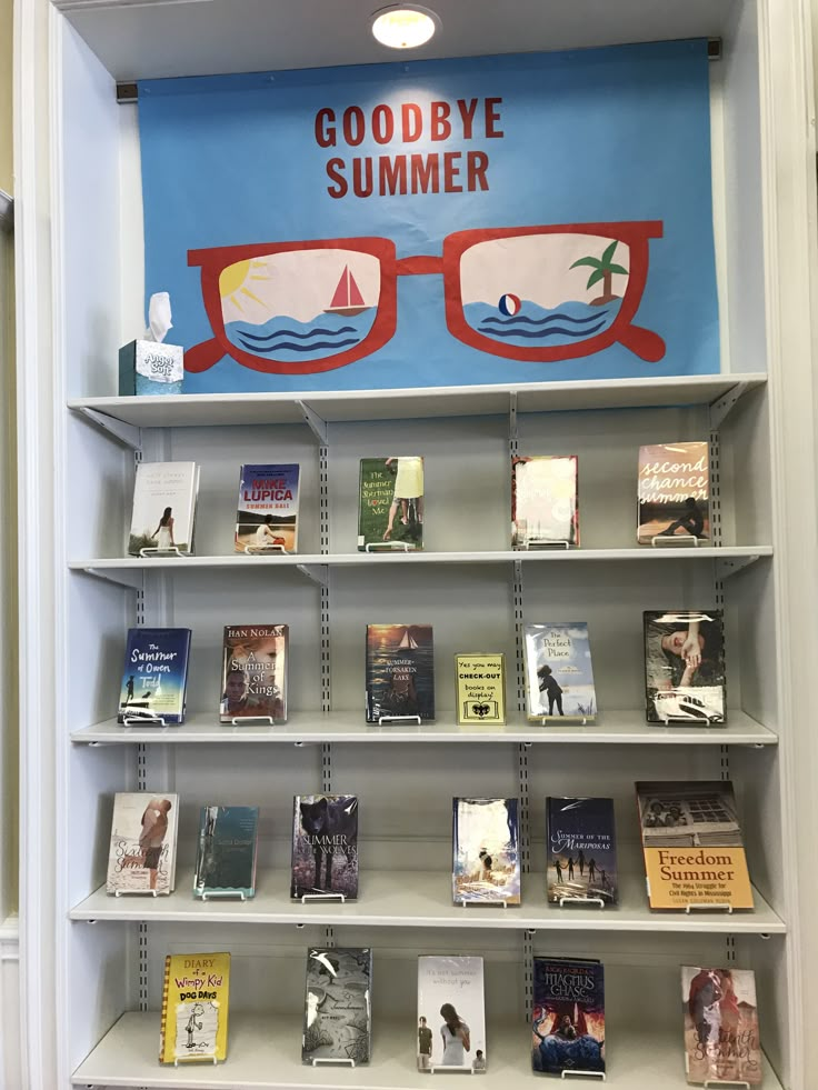 there is a book shelf with many books on it and a sign that says goodbye summer