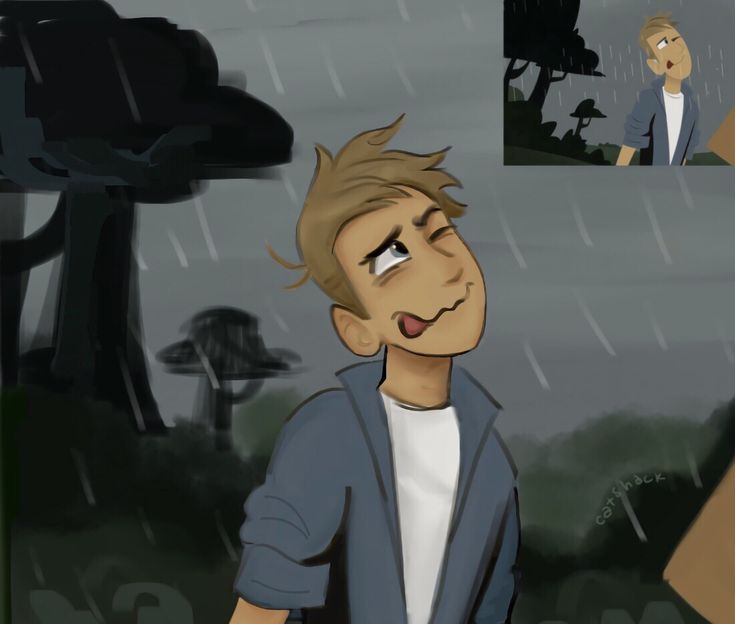 a boy is standing in the rain with his mouth open