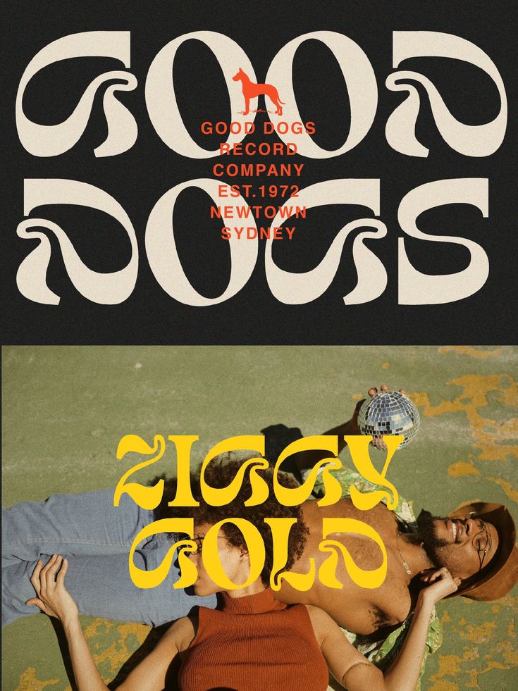 two people are laying on the ground in front of a black and yellow poster that says good dogs