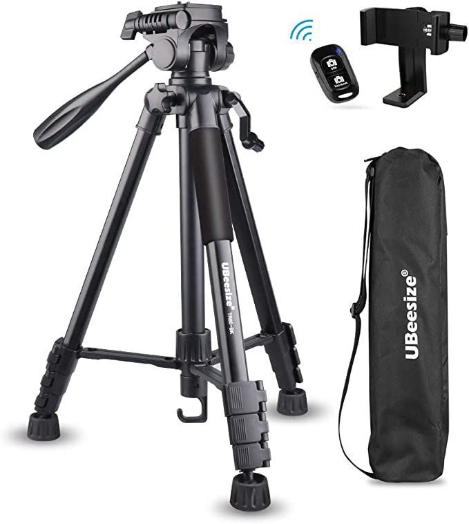 the tripod is next to a bag and remote control