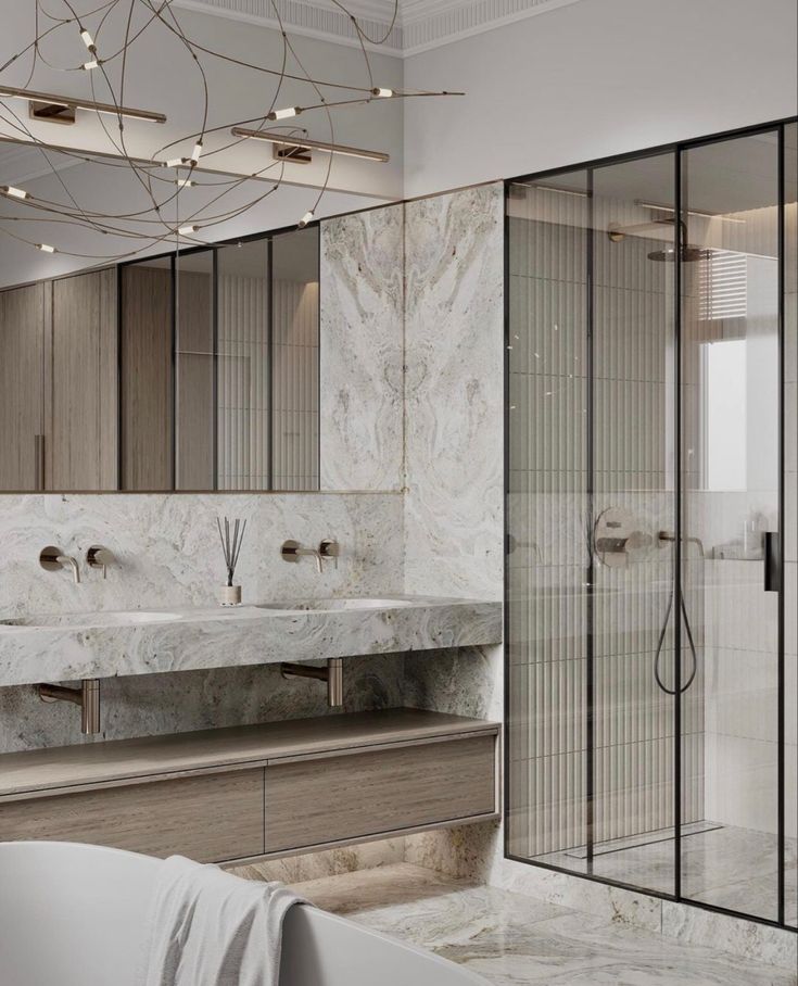 a bathroom with marble walls and flooring next to a bathtub in the corner