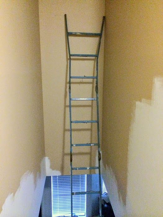 a ladder leaning up against the wall in a room with no paint or trimmings