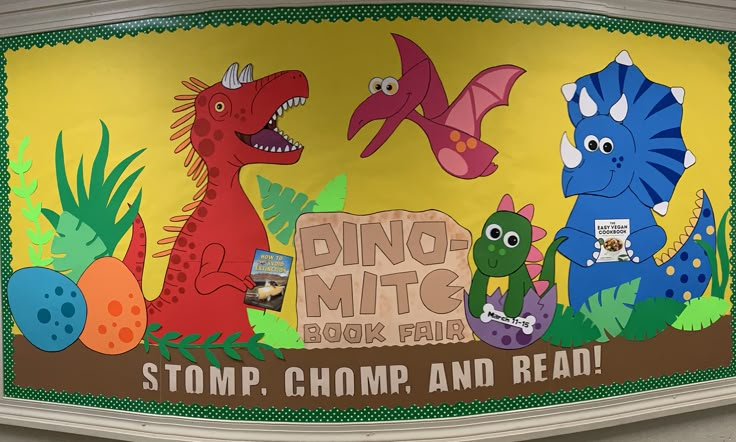 there is a sign that says dino mite book fair with dinosaurs and plants on it