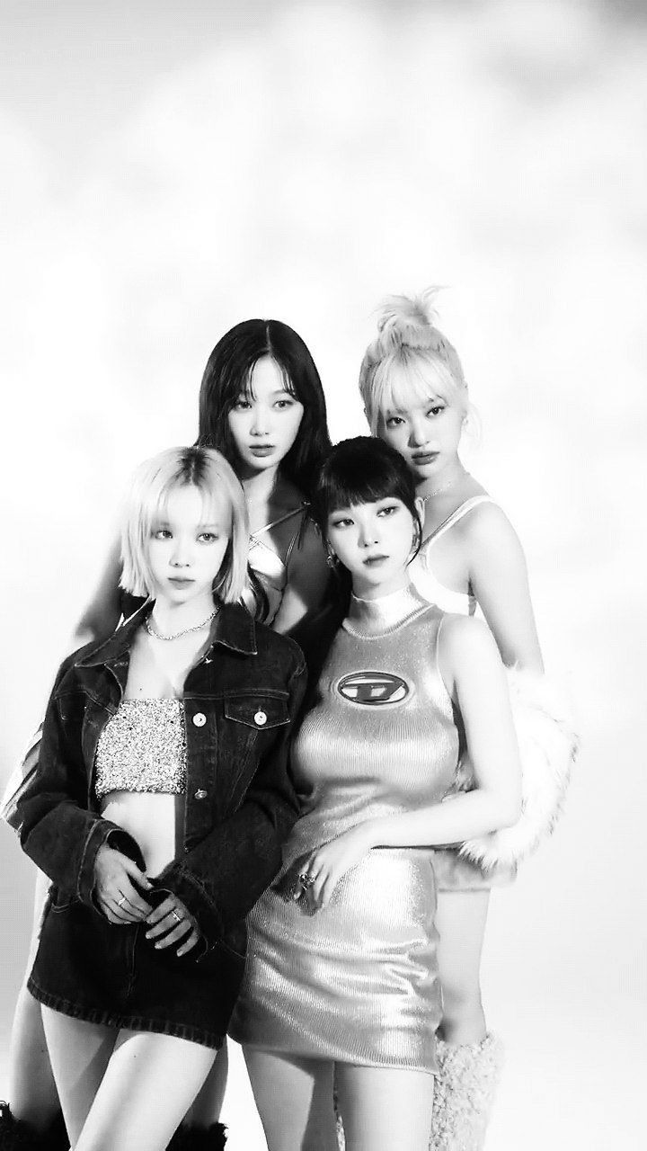 black and white photograph of four girls posing for the camera