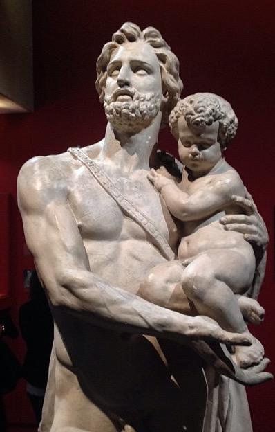 a statue of a man holding a child