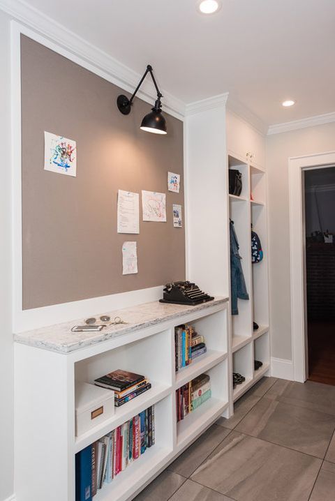 a room with some books on the shelves