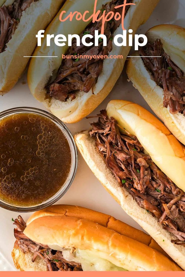 french dip sandwiches on a plate with dipping sauce in the middle and pulled pork sandwich buns next to it