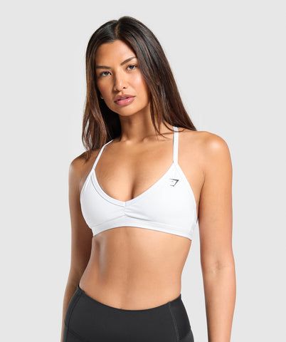 Nike Pros And Sports Bras, Gym Shark Sport Bras, White Sports Bra For Athleisure, Stretch Yoga Bra In White, White Stretch Yoga Bra, White Yoga Bra With Stretch, Sporty White Bra For Workout, White Stretch Athleisure Bra, Sporty White Workout Bra