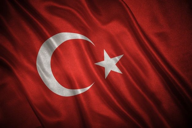 the flag of turkey is shown in this close up photo, it appears to be waving