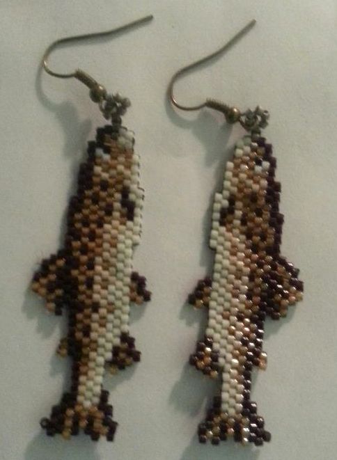 the beaded earrings are shaped like a fish