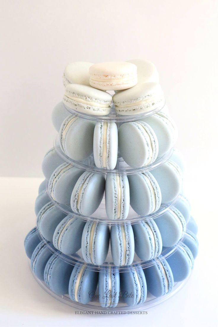 a stack of blue and white macaroons sitting on top of each other