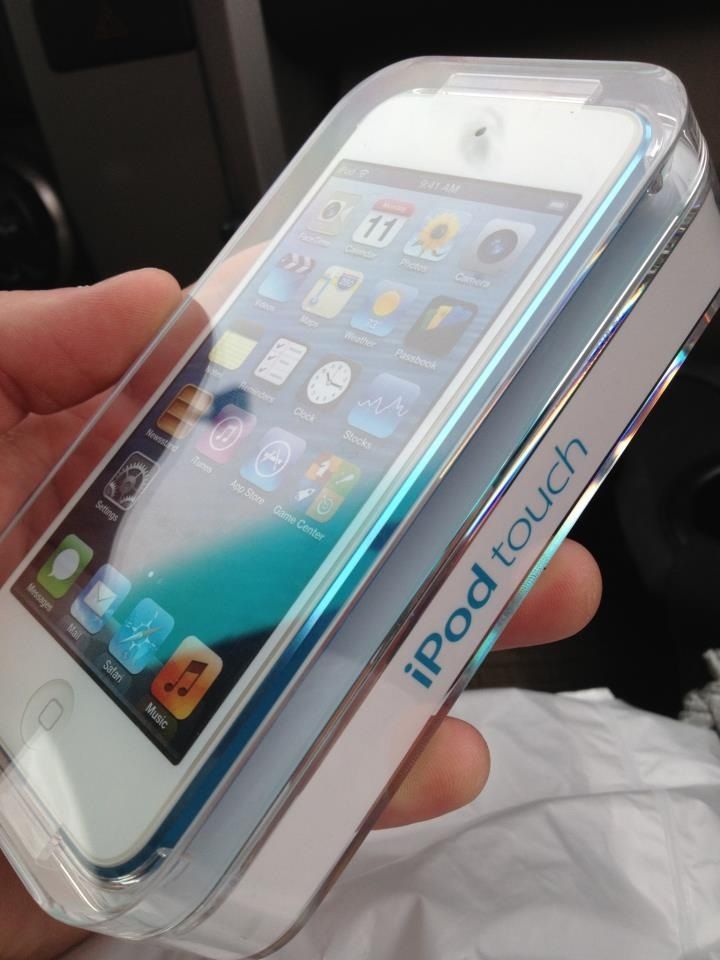 a person holding an iphone in their hand with the screen partially covered by clear plastic