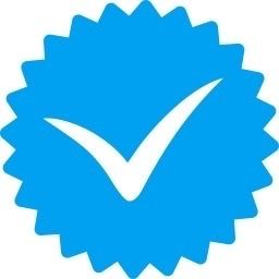 a blue sticker with a check mark on it