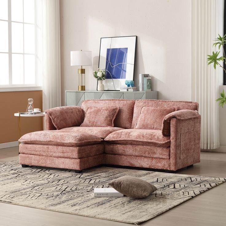 a living room with a sectional couch and rug