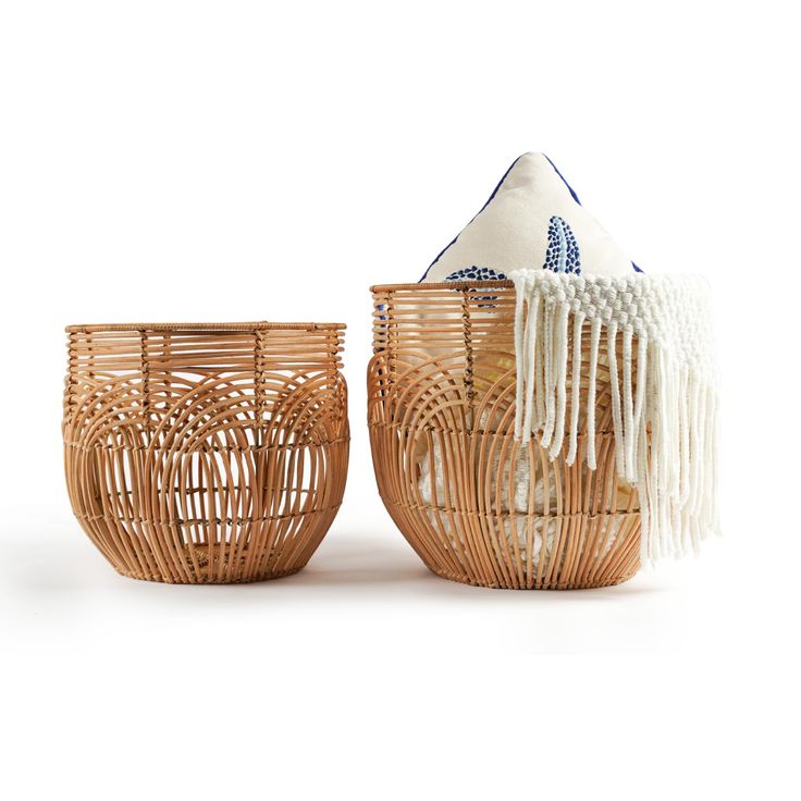 two woven baskets sitting next to each other