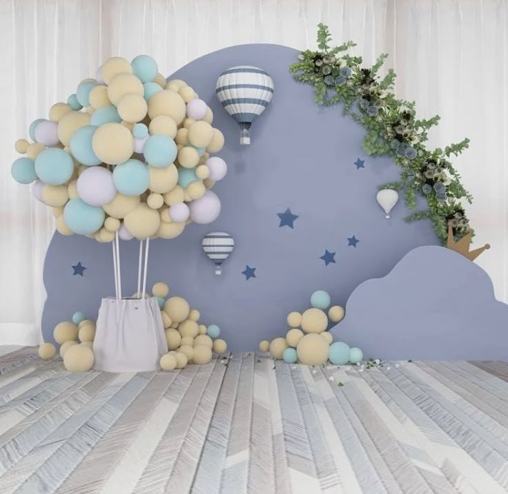 balloons are floating in the air above a bed with stars and clouds on it's head