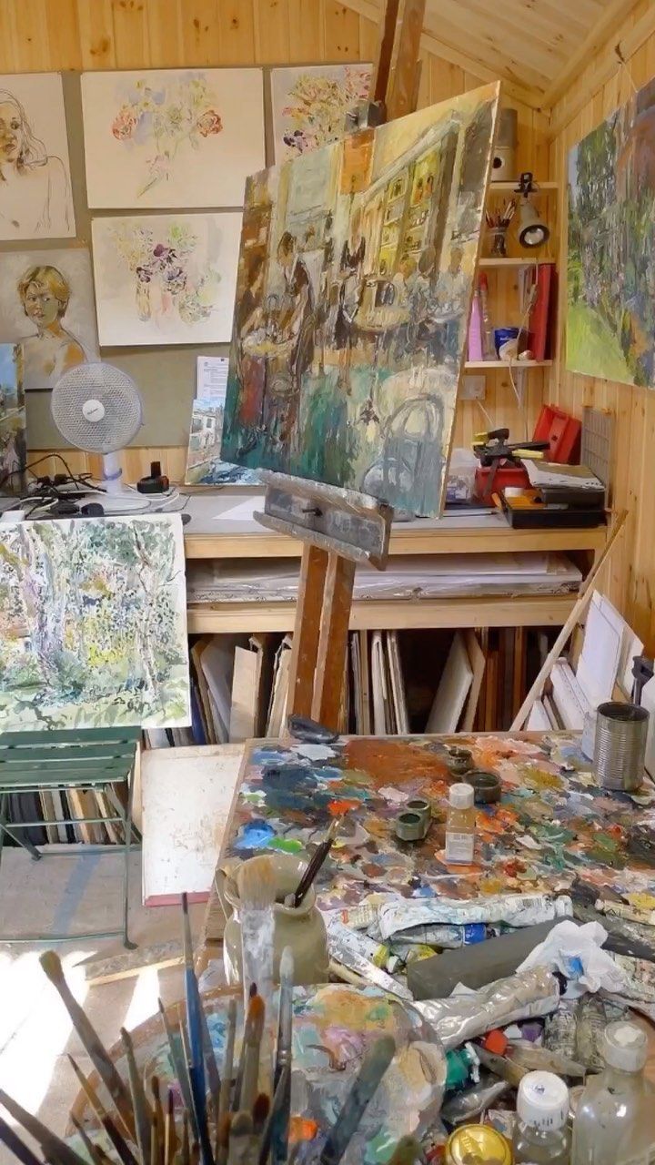 an artist's studio filled with lots of art supplies